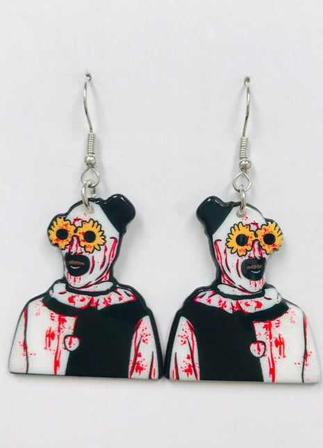 Art the Clown earrings made of acrylic, featuring a horror design with blood splatters and flowered glasses.
