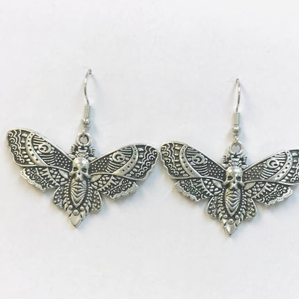 Silver death moth earrings with intricate detailing, measuring 28mm high and 43mm wide.