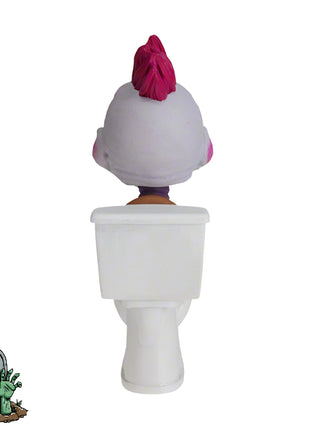 Baby Killer Klown figurine with pink hair sitting on a white toilet, viewed from the back.