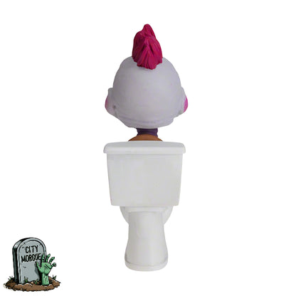 Baby Killer Klown figurine with pink hair sitting on a white toilet, viewed from the back.