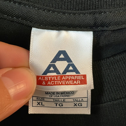The Devils Rejects vintage promo tee tag showing size XL and brand Alstyle Apparel & Activewear.