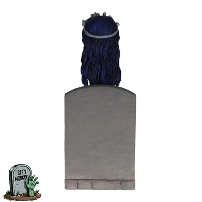 Royal Bobbles Emily bobblehead with long blue hair, wearing a floral headband, set against a gray tombstone background.